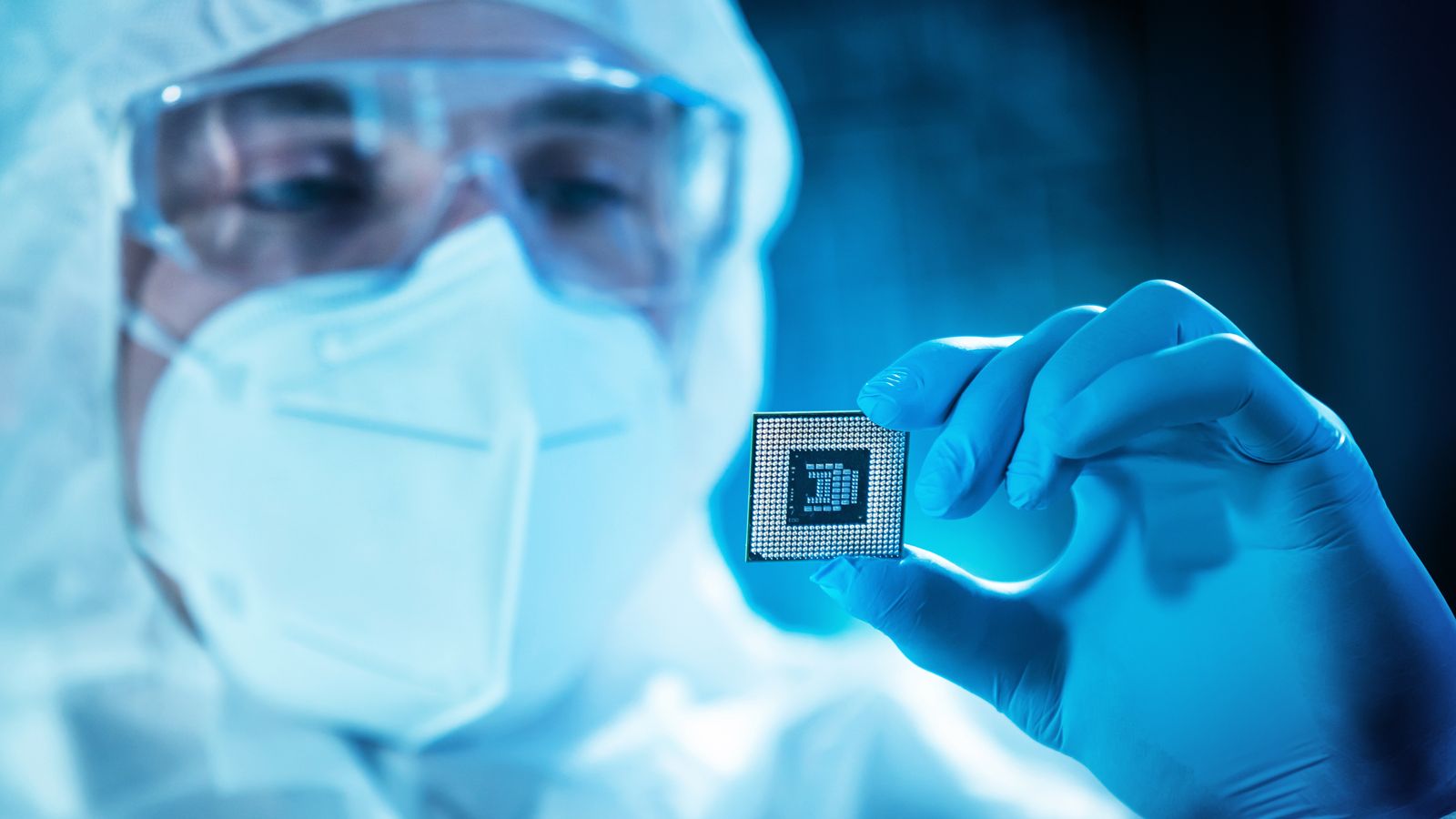 worker holding computer chip